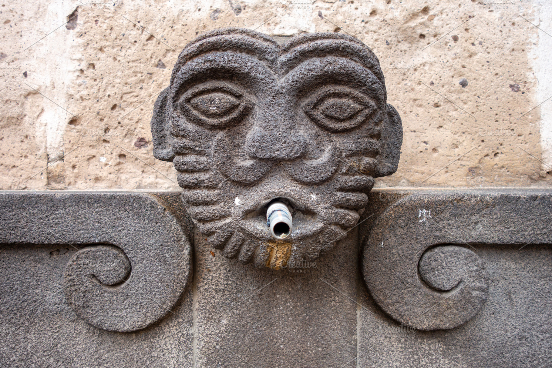 Stone face fountain in Arequipa, Peru, an Architecture Photo by GoodGoods