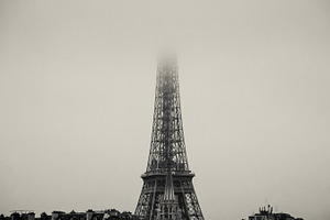 Eiffel Tower dissolving in fog