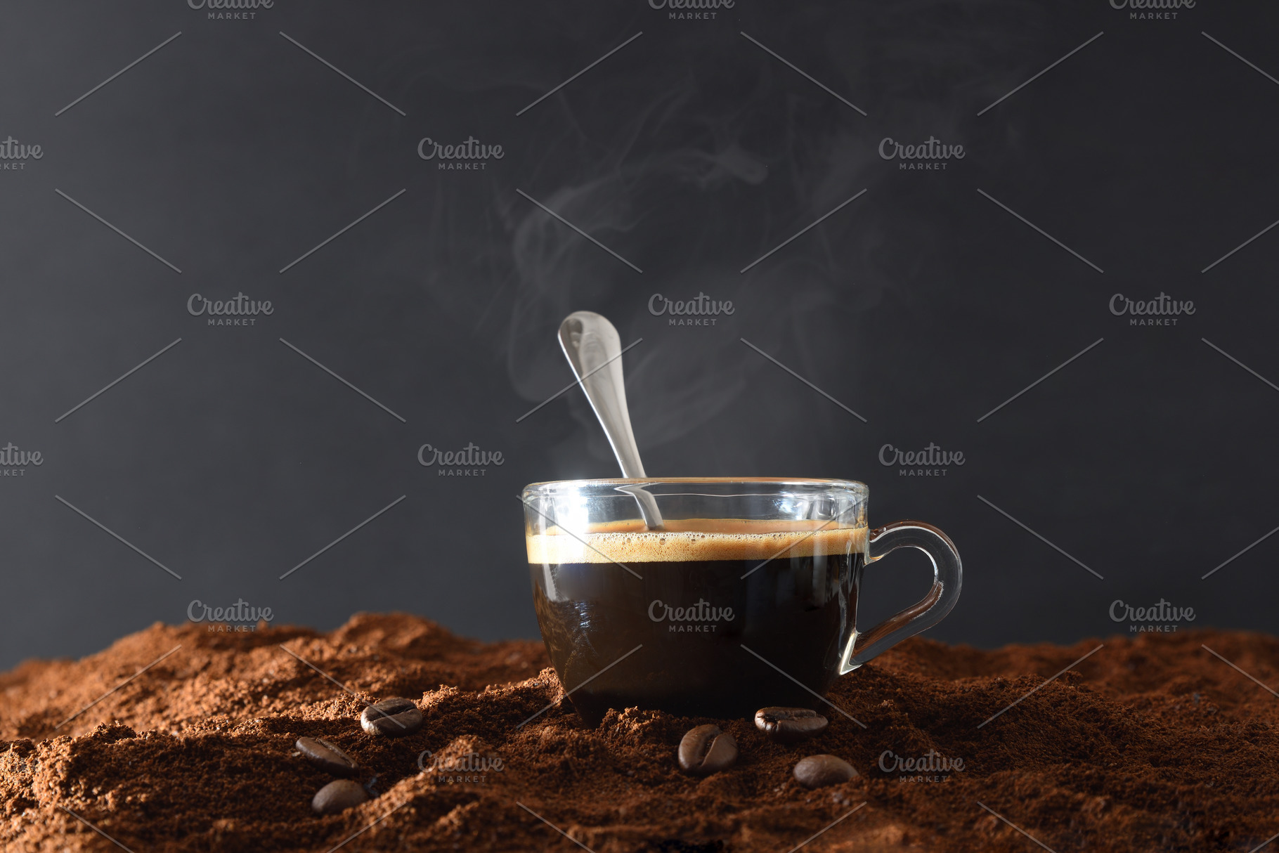 Cup of hot coffee over ground coffee and dark background, a Food & Drink Photo by Davizro's Market