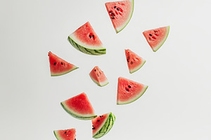 Juicy Watermelon Slices Falling Whit, a Food & Drink Photo by Pixeness Studio