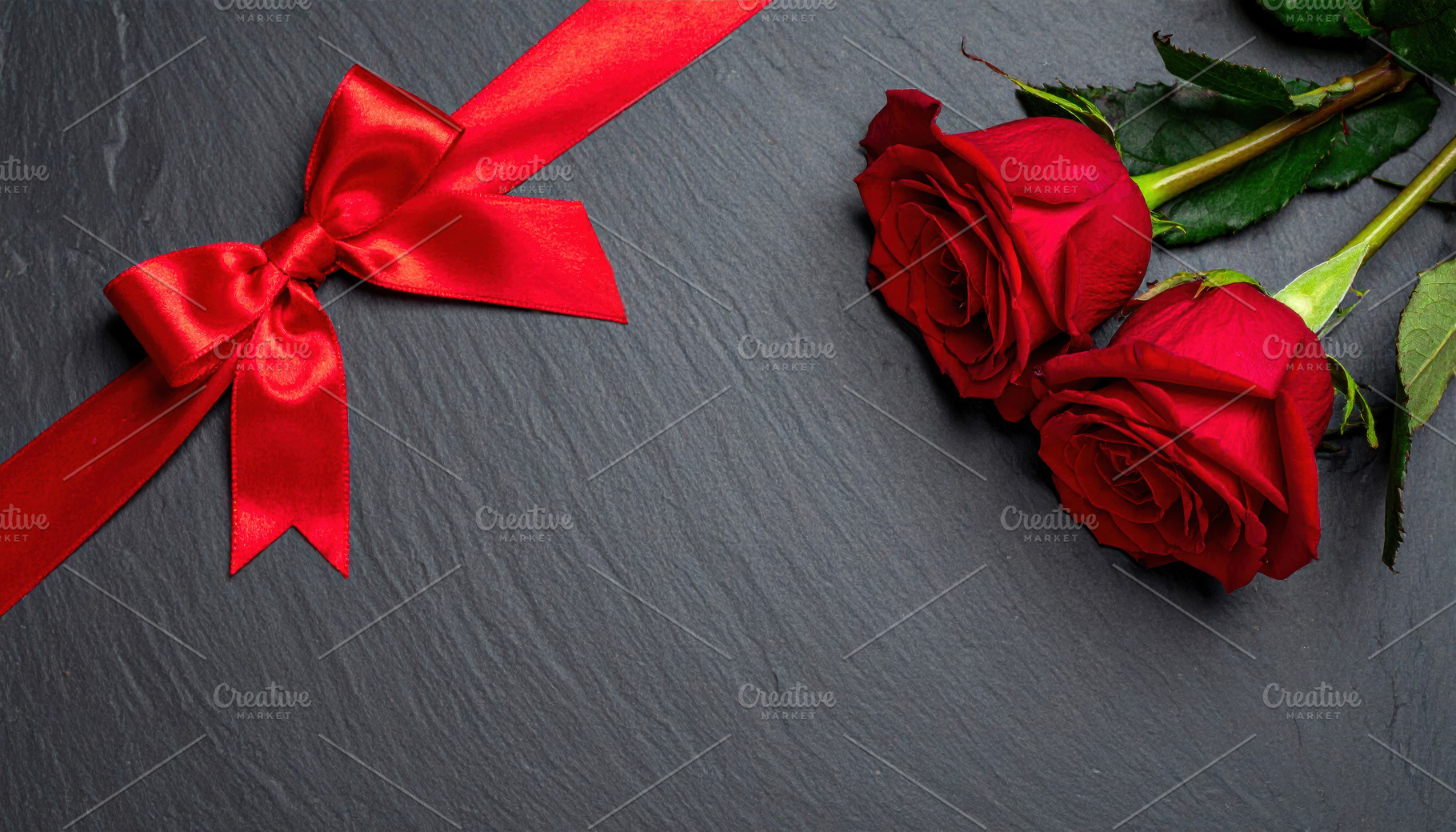 Red roses and ribbon on dark background, a Holiday Photo by Davizro's Market