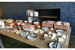 Buffet table with cheese, cold cut, a Food & Drink Photo by sceptical cactus