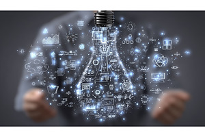A woman's hand cradles a lightbulb, a Business Photo by ZinetroN