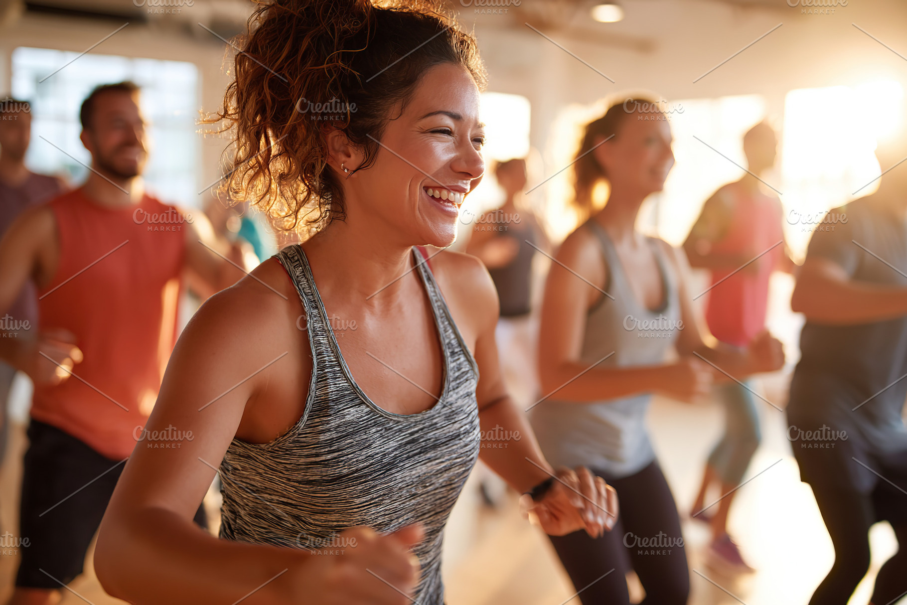 Joyful participants engage in an energizing fitness class in a sunlit studio, a Person Photo by AlyaAnd