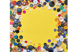 Colorful button border frame with, a Background Photo by Gladkov photography