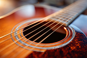 Close-up of an acoustic guitar, an Arts & Entertainment Photo by AlyaAnd
