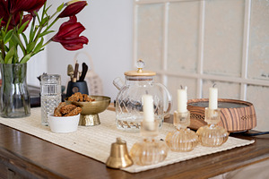Table setting tea ceremony arrangement candle, a Background Photo by Photo Drive Studio