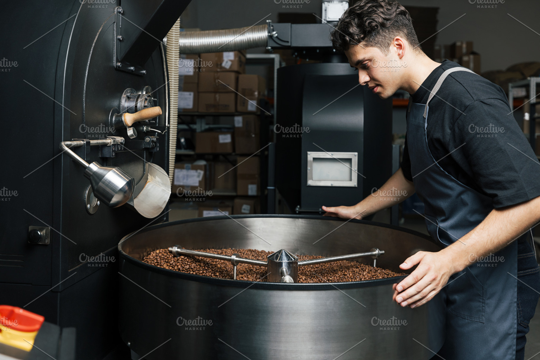 Male worker in an apron standing, a Food & Drink Photo by Artem Varnitsin