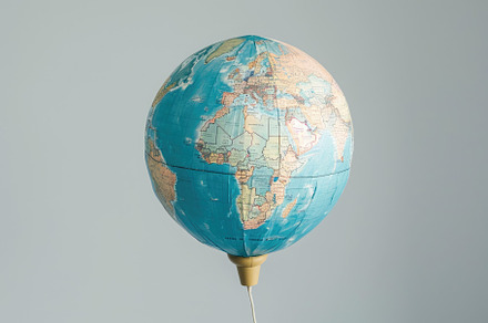 A hot air balloon adorned with a map, a Photo by Iftikhar Alam