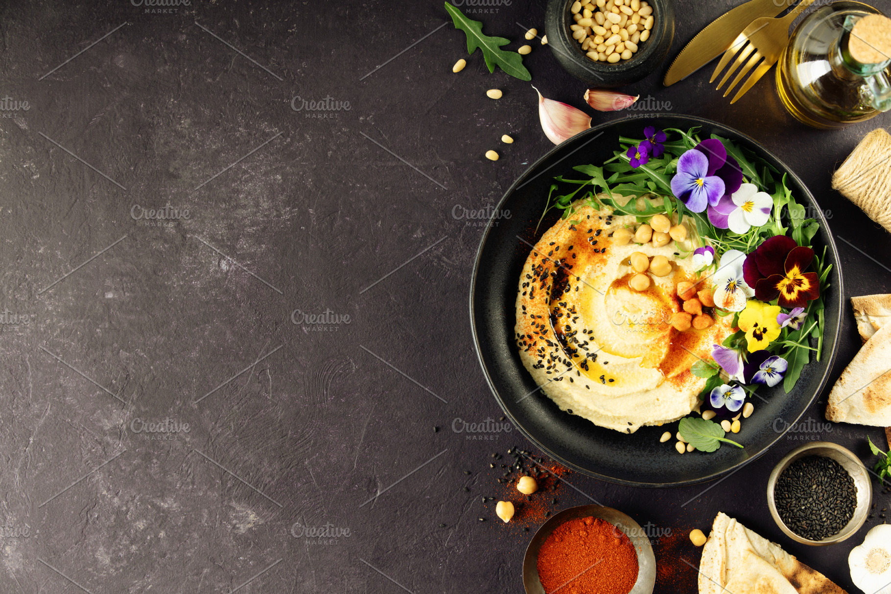 Gourmet Hummus with Edible Flowers and Spices on Dark Background, a Food & Drink Photo by Natalia Klenova's Shop
