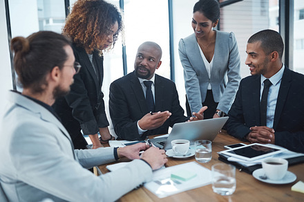 Aligning his team through effective communication, a Photo by Peopleimages.com
