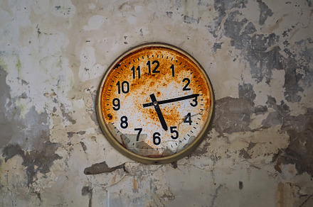 Old broken rusty wall clock in an abandoned building in Pripyat, Chornobyl Excl