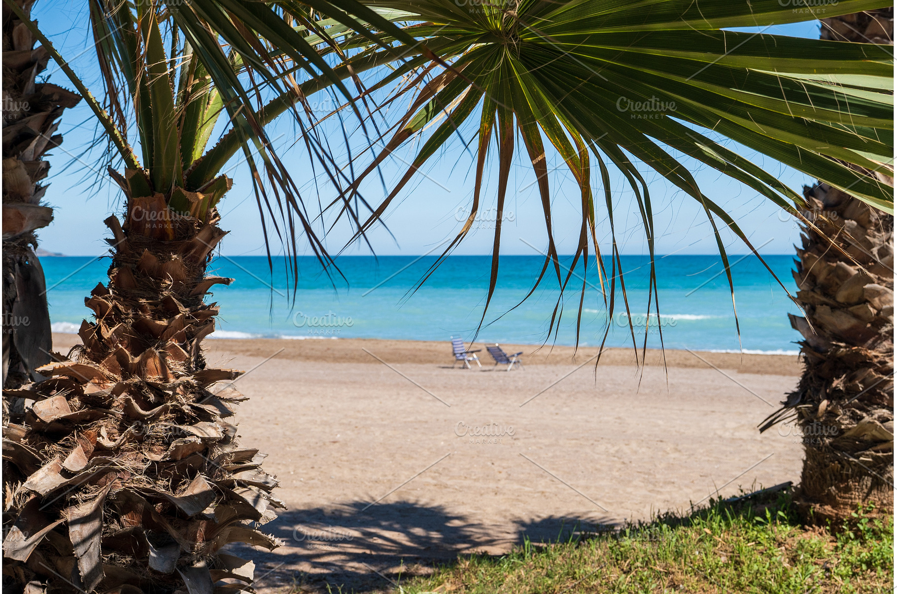 Two chairs on a sandy beach in Spain, a Nature Photo by VictorGrow