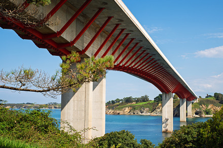 Modern bridge with a red structure o