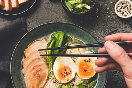 Eating japanese ramen noodle soup, a Food & Drink Photo by The baking man
