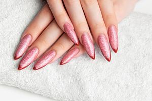 Woman's hands resting on towel with pink stiletto nails, a Beauty & Fashion Photo by Olena Rudo