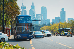Public bus in motion against a, an Architecture Photo by Our Amazing World