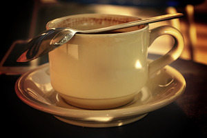 A cup of coffee with spoon