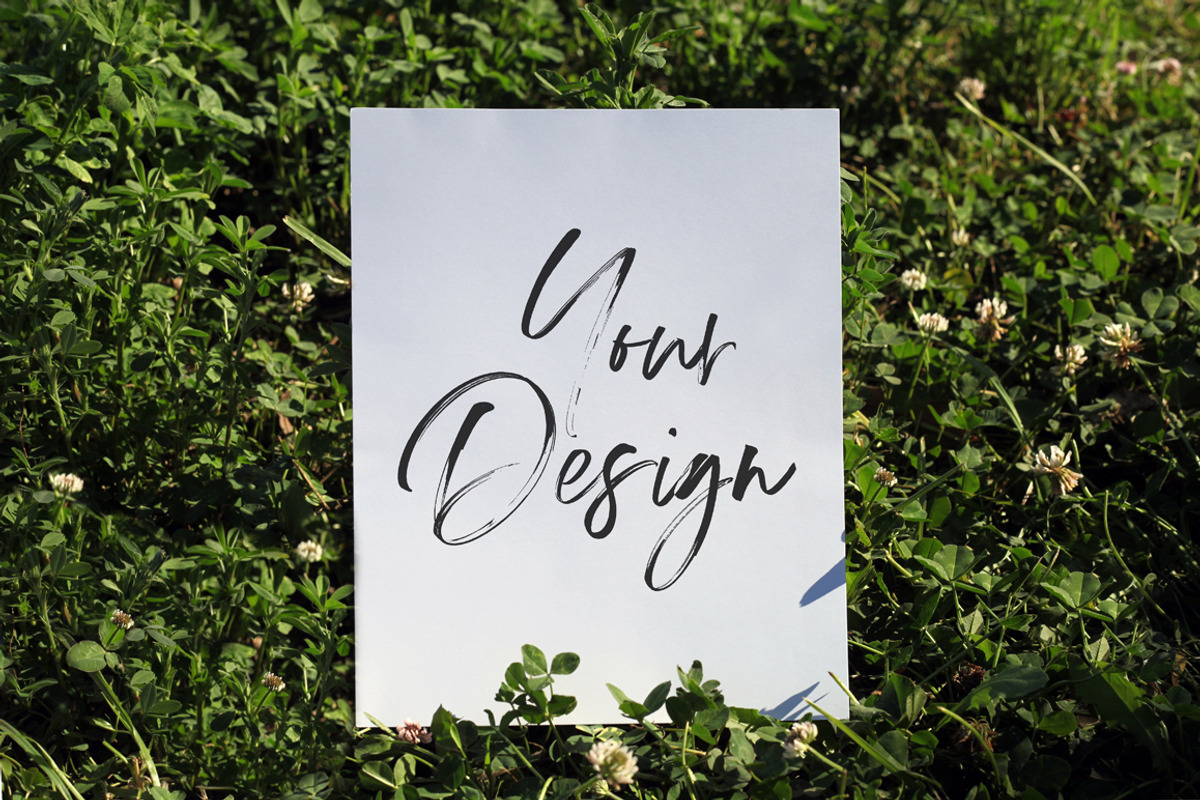 Poster Mockup on Grass, an Advertising Mockup by pixelcolours 2 (Photo 1 of 2)