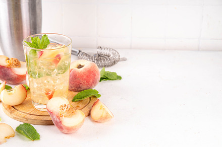 Flat chinese peach and lime lemonade, mojito cocktail