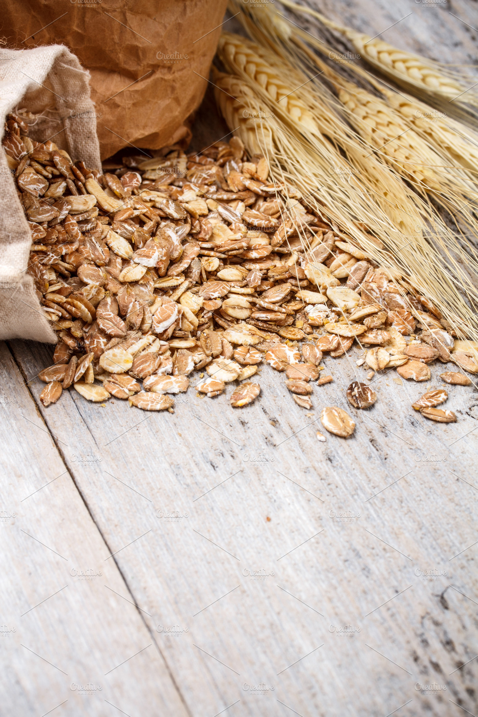 Oat flakes stock photo containing bag and board