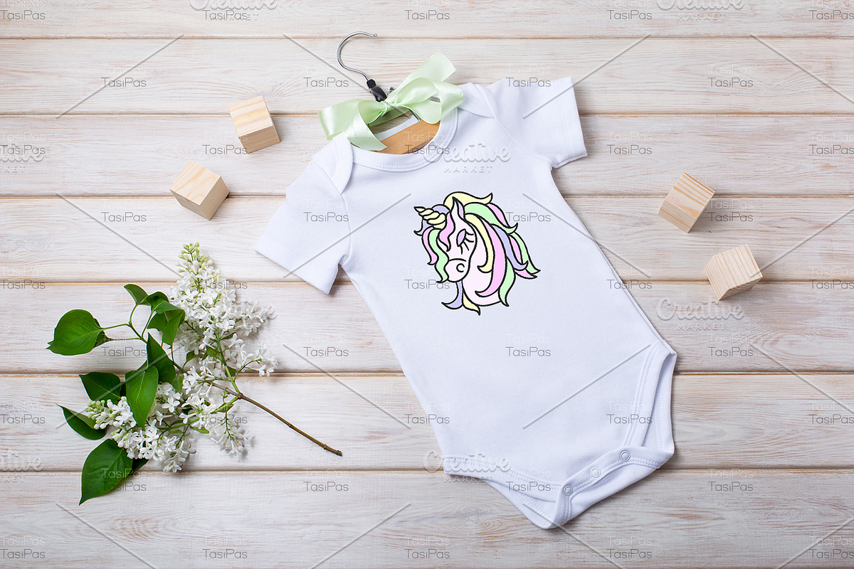 Baby onesie mockup with white lilac., a Shirt Mockup by TasiPas (Photo 2 of 4)