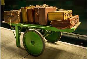 Historic antique luggage cart with, a Transportation Photo by Backyard Stock