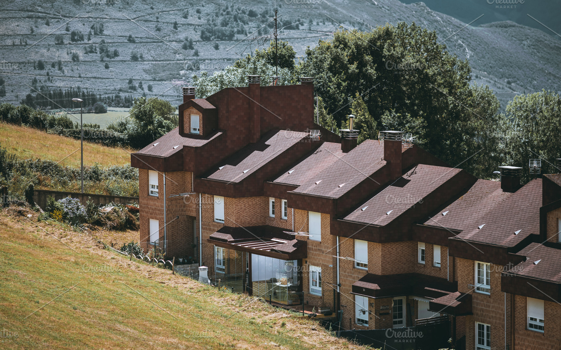 Hillside brick townhouses; Spain, an Architecture Photo by SkyNext