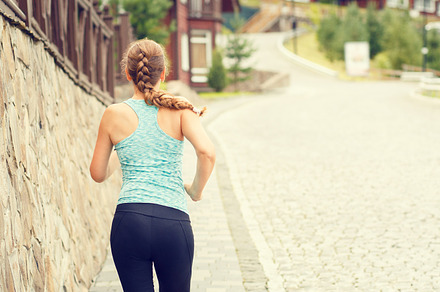 Athletic girl running on street in mountains town, a Sports & Recreation Photo by serkum
