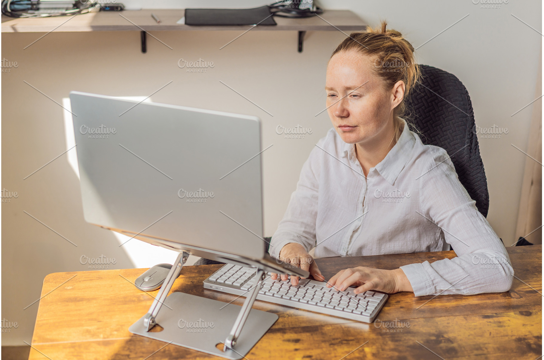 Woman working in her home office, a Person Photo by Elizaveta Galitskaya