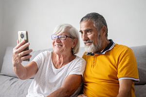 Senior couple taking selfie with smartphone, a Person Photo by etorres69
