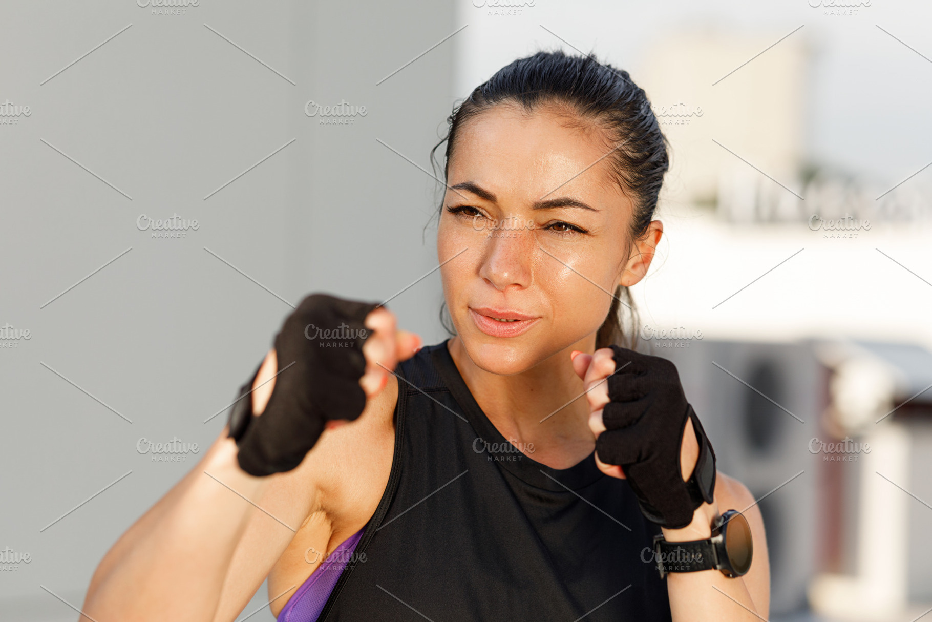 Woman in a fight pose with her fists, a Sports & Recreation Photo by Artem Varnitsin
