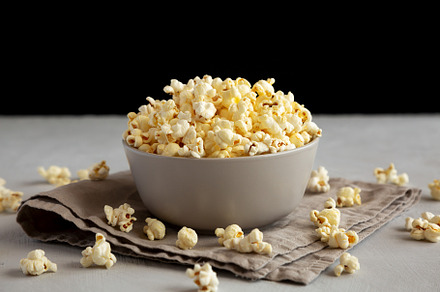 Homemade Salty Popcorn in a Bowl, side view., a Food & Drink Photo by LiudmylaChuhunova