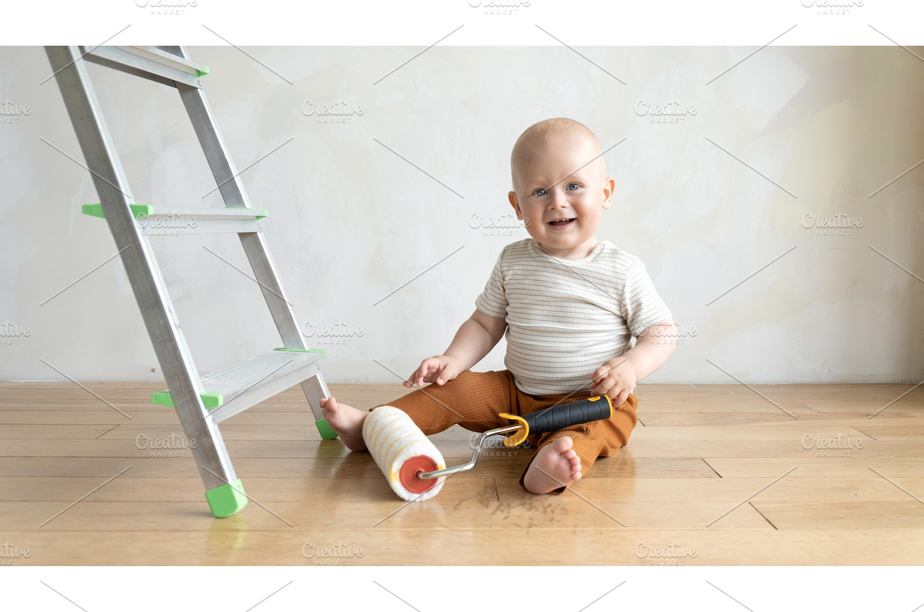 Baby boy with painting roll near, an Architecture Photo by Enjoy Photo