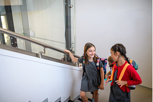 Children with backpacks climbing, a School & Education Photo by HalfPoint