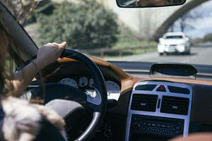 Hand of a woman driving a car featuring adult, auto, and automobile, a Person Photo by Am.Benitez Estudio