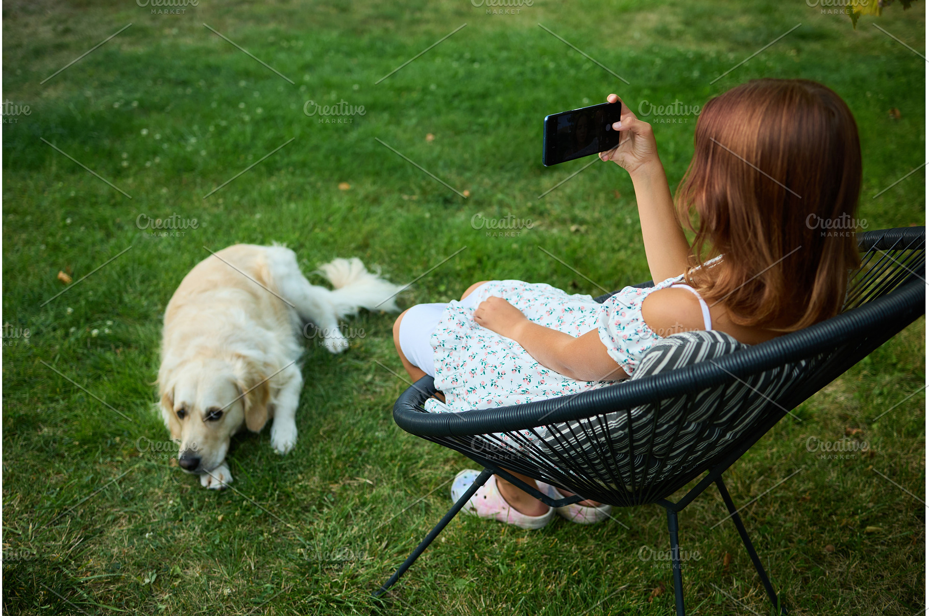 Young girl takes selfie in garden, a Nature Photo by IlliaBondarPhotography