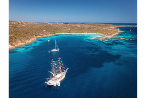 Aerial view of sail boat and luxury, a Transportation Photo by den-belitsky
