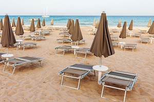 Empty beach with closed paraso, a Holiday Photo by BOOCYS