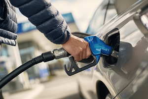 Filling up gas at a station, a Photo by Beautiful things