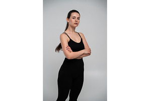 Young woman in black athletic wear, a Sports & Recreation Photo by volodymyrshtun13795