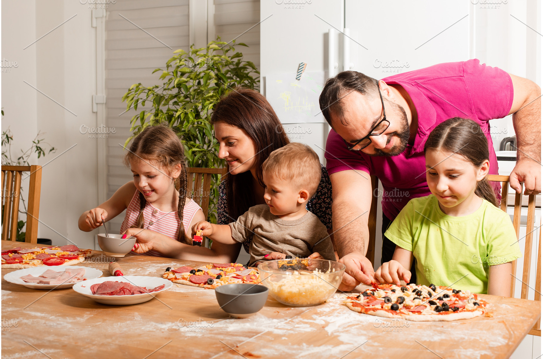 the young parents are cooking with, a Person Photo by oksix