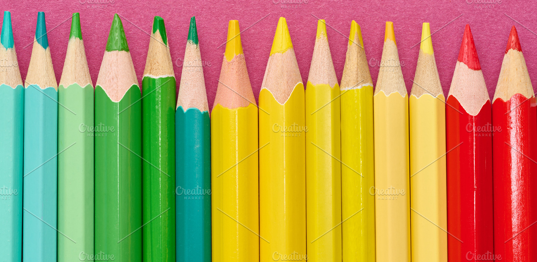 Multicolored wooden pencils in a row, drawing and creativity too, a School & Education Photo by ndanko