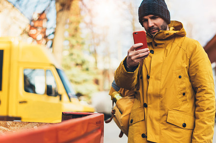 Writes a message on the smartphone stock photo containing hipster and yellow