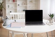 Laptop Computer With Empty Screen Standing On Table At Home, a Photo by Prostock-Studio (Thumbnail 1 of 2)