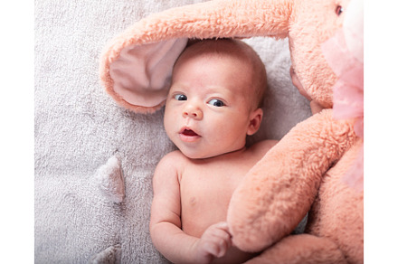 Pretty smiling baby girl and toy stock photo containing baby and childhood