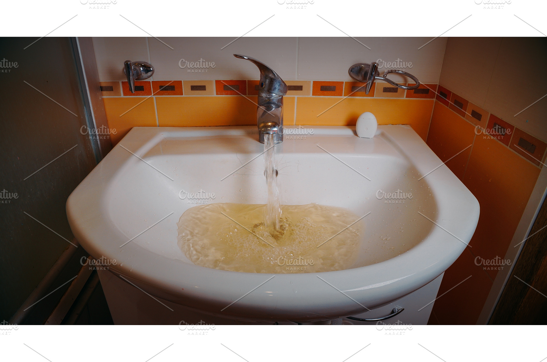Running water in basin with yellow, a Nature Photo by Our Amazing World