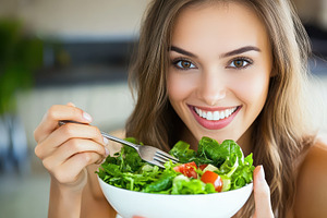 Smiling woman enjoys fresh organic, a Photo by Pavel_design