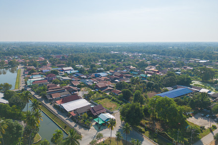 Aerial view of local residential neighborhood roofs. Urban housi