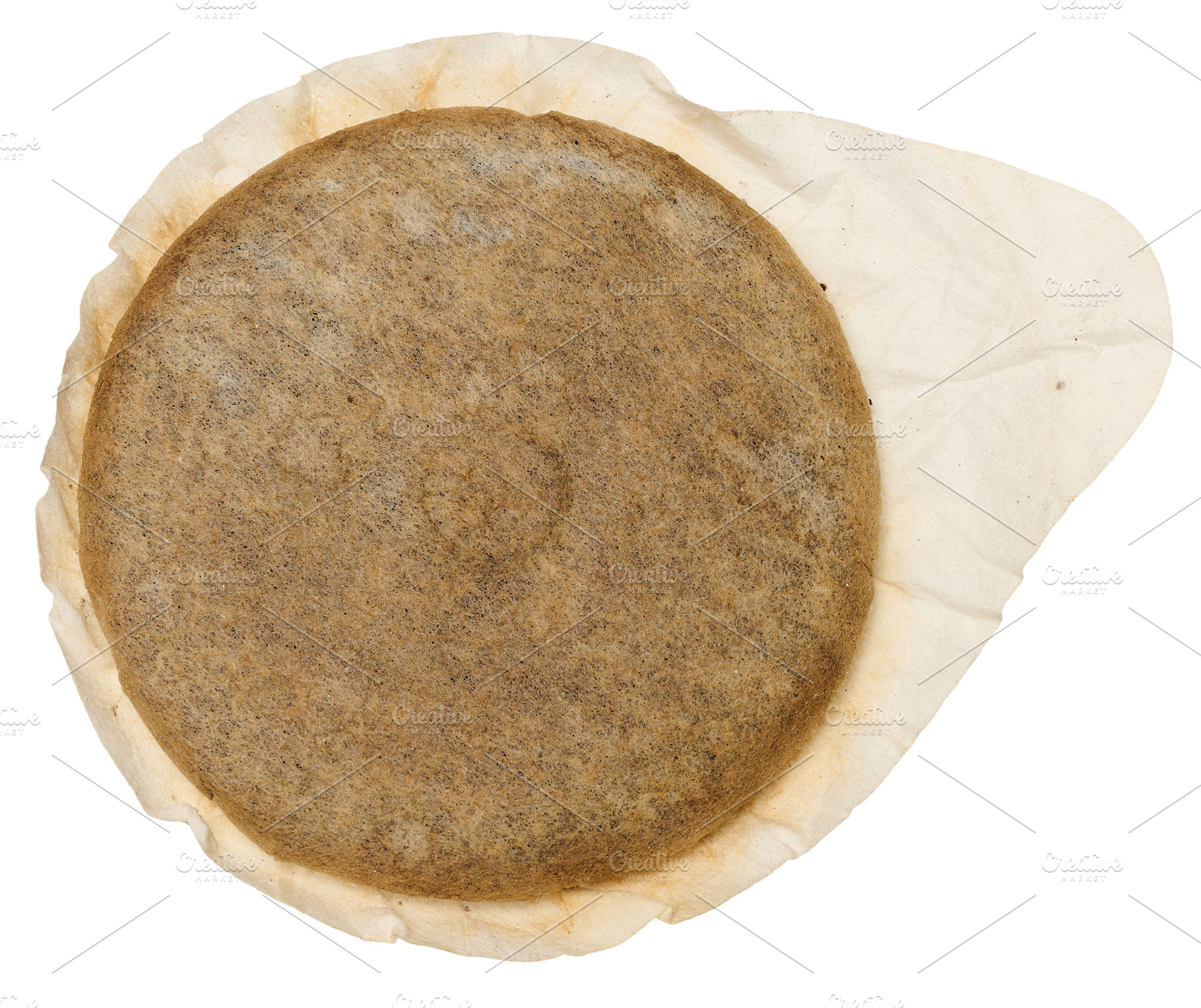 A round coffee pod or single serving of ground coffee wrapped in, a Food & Drink Photo by ndanko